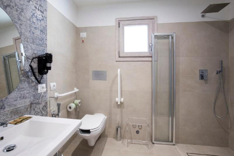 Hotel Caramare Cala Gonone Bagian luar foto